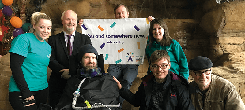 Image of a group of people with a Disabled Access Day banner