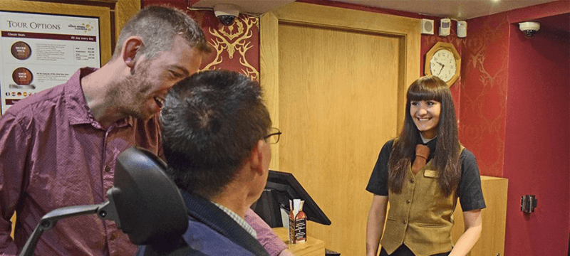 Image of people at a reception desk of an attraction.