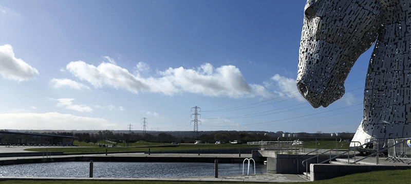Image of The Kelpies looking out over water and countryside.